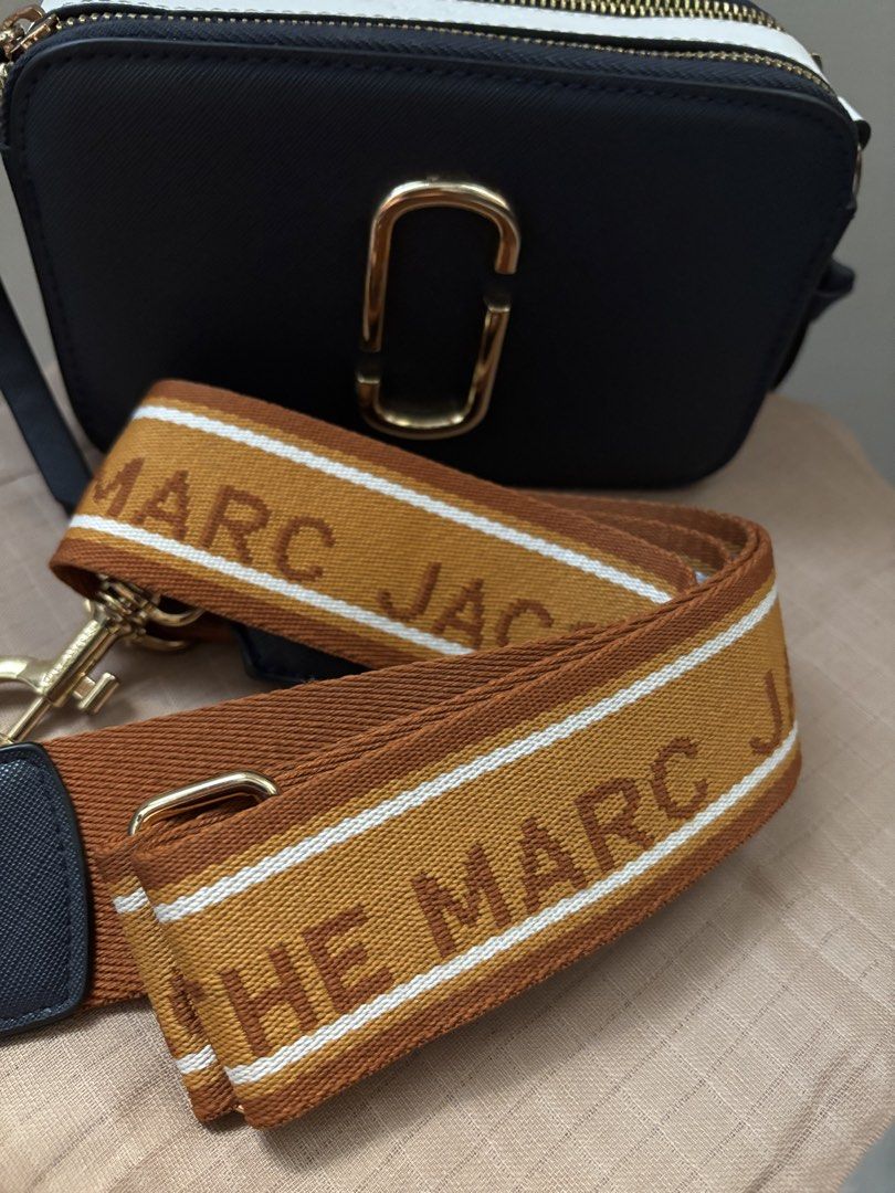 Marc Jacobs Snapshot Camerka Bag Black Gold Strap (Category: Luxury Bags & Wallets) located in Santa. Submitted by catherinee. (Listing ID 1441154887, Image 2). Description: - Authentic Black Marc Jacobs Snapshot bag - Gold hardware and logo - Includes signature "The Marc Jacobs" strap - White trim detail on top - Ideal for everyday use - Fits all your essentials • perfect for errands, or casual outings! 📍Ilocos Sur 📩Message for any inquiries! 