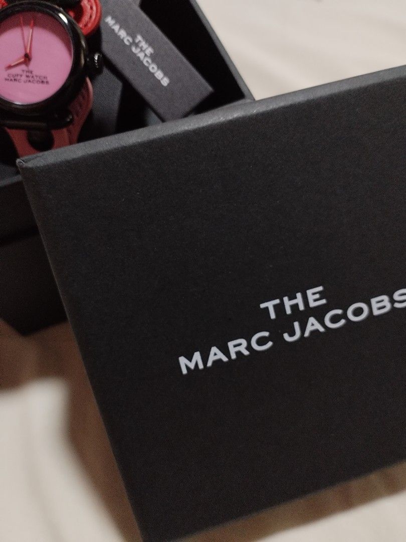 Marc Jacobs The Cuff Watch Pink Face Red Leather (Category: Women's Watches) located in Quezon City. Submitted by themissingpiecesarehere (Listing ID 1441045505, Image 3). Description: - Authentic Marc Jacobs cuff watch - Features a vibrant pink watch face - Complemented by a chic red leather strap - Includes the original box for safekeeping - Original retail price: ¥36,000 JPY - Perfect for making a bold fashion statement.