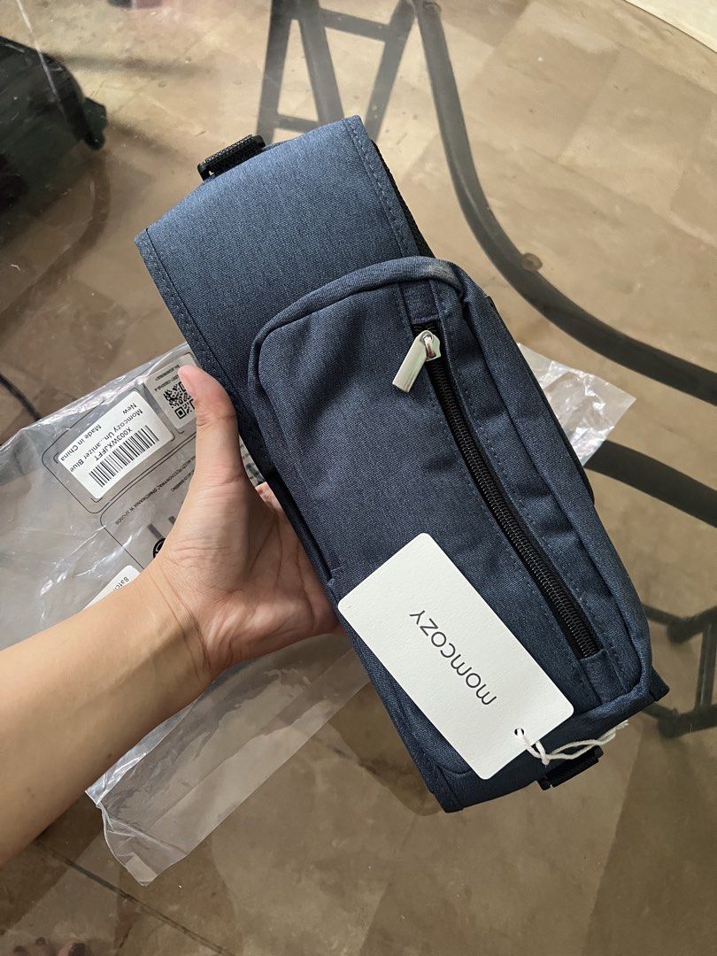 Momcozy Stroller Organizer Bag - Blue (Category: Strollers) located in Quezon City. Submitted by charlenedv58782 (Listing ID 1441111226, Image 1). Description: Option 2 – Marketplace Style FOR SALE: Momcozy Stroller Organizer ✅ Brand New with Tag ✅ Never Used ✅ Spacious main compartment ✅ Dual insulated bottle holders ✅ Front detachable zip pouch ✅ Durable and lightweight - Momcozy stroller organizer bag - Multiple compartments and cup holders - 
