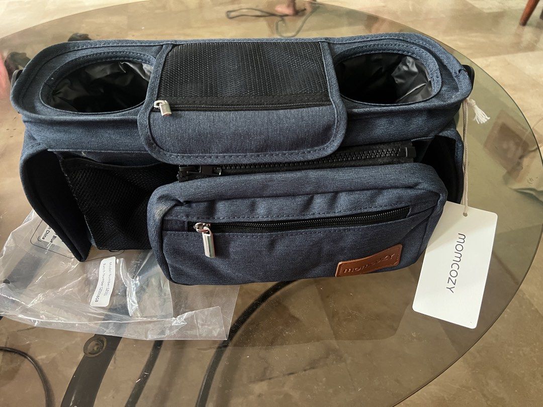 Momcozy Stroller Organizer Bag - Blue (Category: Strollers) located in Quezon City. Submitted by charlenedv58782 (Listing ID 1441111226, Image 3). Description: Option 2 – Marketplace Style FOR SALE: Momcozy Stroller Organizer ✅ Brand New with Tag ✅ Never Used ✅ Spacious main compartment ✅ Dual insulated bottle holders ✅ Front detachable zip pouch ✅ Durable and lightweight - Momcozy stroller organizer bag - Multiple compartments and cup holders - 