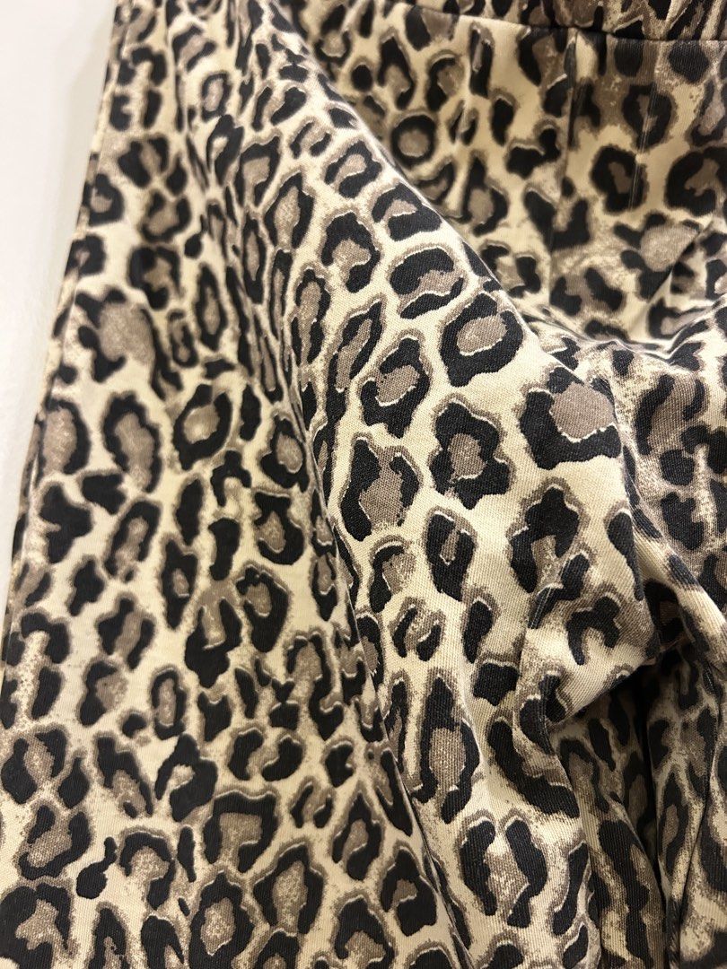 NA-KD Leopard Print Flare Pants Size 34 (Category: Other Bottoms) located in Makati City. Submitted by thriftbyhumble (Listing ID 1441062834, Image 3). Description: - NA-KD Leopard Print Flare Pants - Size: 34 - Material: Comfortable and stretchy - Style: Bold, statement piece - Perfect for pairing with a simple top to highlight the pants.