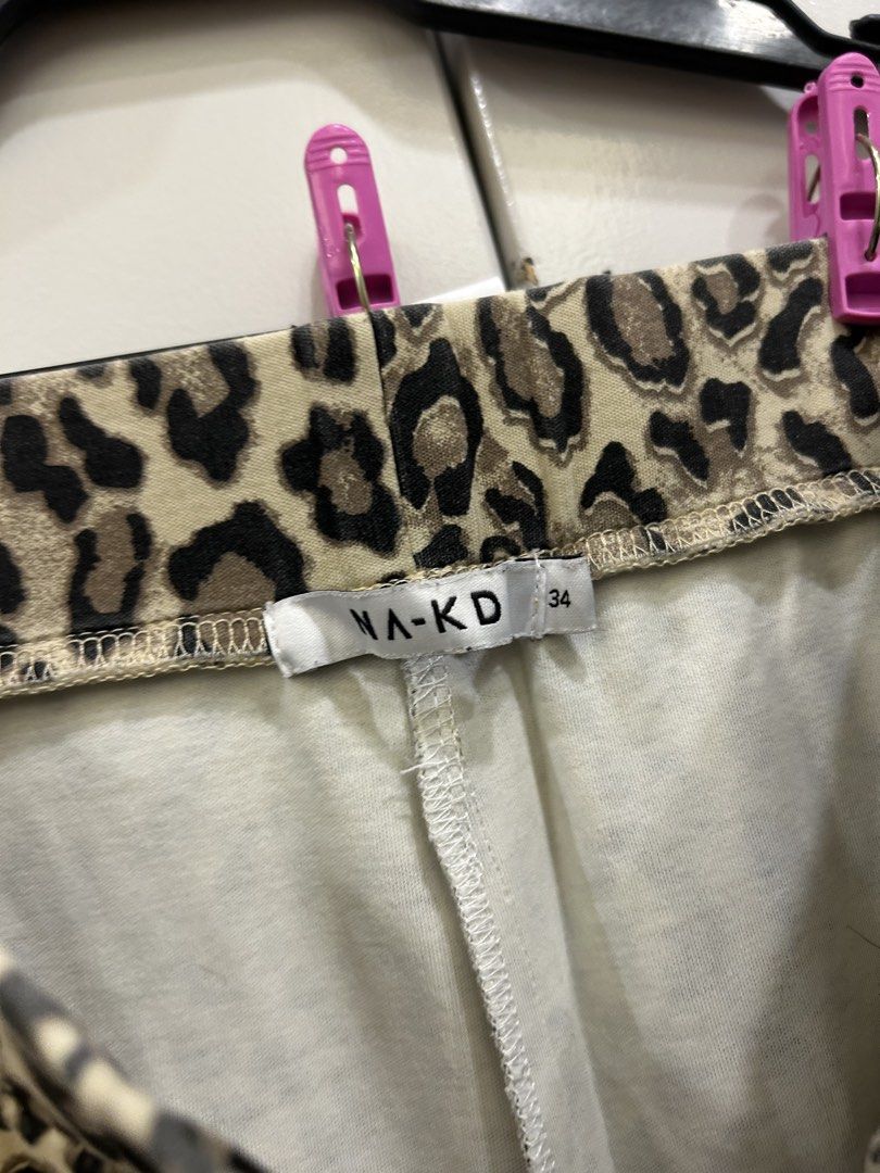NA-KD Leopard Print Flare Pants Size 34 (Category: Other Bottoms) located in Makati City. Submitted by thriftbyhumble (Listing ID 1441062834, Image 2). Description: - NA-KD Leopard Print Flare Pants - Size: 34 - Material: Comfortable and stretchy - Style: Bold, statement piece - Perfect for pairing with a simple top to highlight the pants.