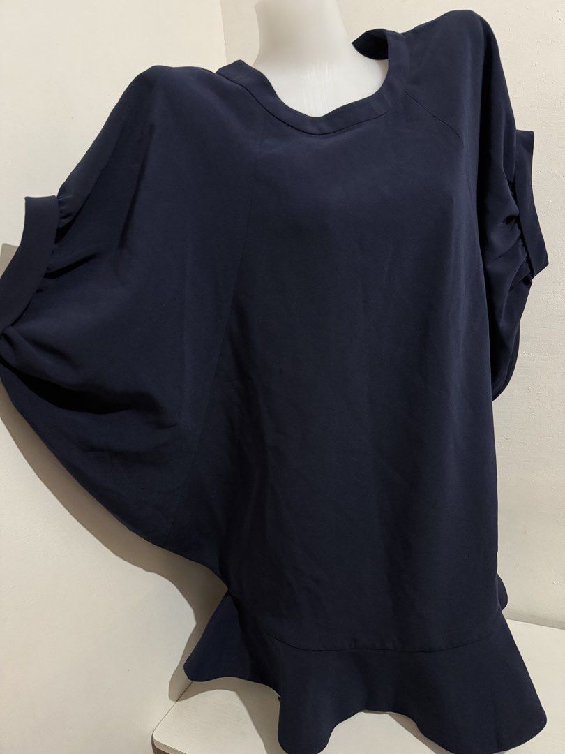 Navy Blue Dolman Sleeve Top with Ruffle Hem (Category: Blouses) located in Manila. Submitted by amoremiamore (Listing ID 1441145543, Image 3). Description: - Navy blue top - Unique dolman sleeves with ruched detail - Flared ruffle hemline - Flowy and comfortable fabric - Perfect for dressing up or down - Easy to pair with pants or skirts.