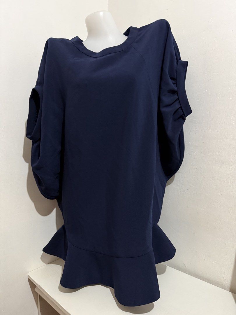 Navy Blue Dolman Sleeve Top with Ruffle Hem (Category: Blouses) located in Manila. Submitted by amoremiamore (Listing ID 1441145543, Image 2). Description: - Navy blue top - Unique dolman sleeves with ruched detail - Flared ruffle hemline - Flowy and comfortable fabric - Perfect for dressing up or down - Easy to pair with pants or skirts.