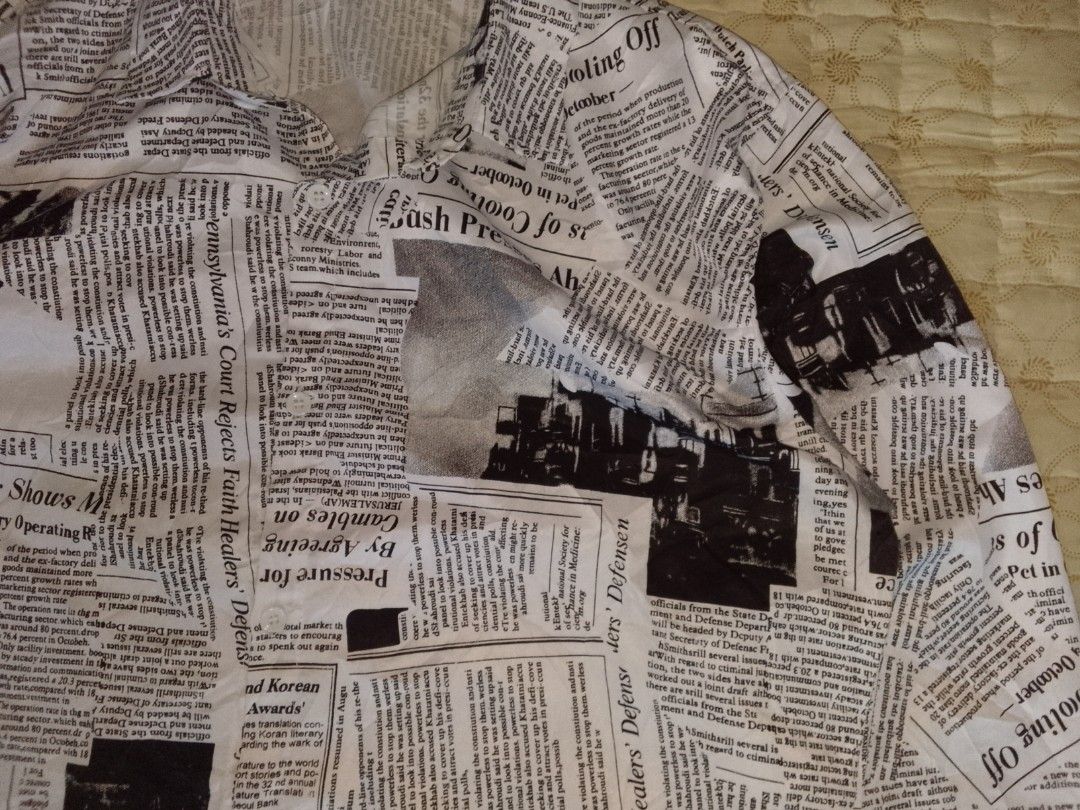 Newspaper Print Long Sleeve Button Up Shirt (Category: Coats, Jackets and Outerwear) located in Zamboanga. Submitted by nurbya898048 (Listing ID 1440979885, Image 2). Description: - Unique long sleeve button-up shirt - All-over newspaper print design - Makes a bold fashion statement - Versatile: pairs well with jeans or shorts - Stand out from the crowd with this eye-catching piece - Excellent condition - Color rate 10/10 - Size fit to large - Di
