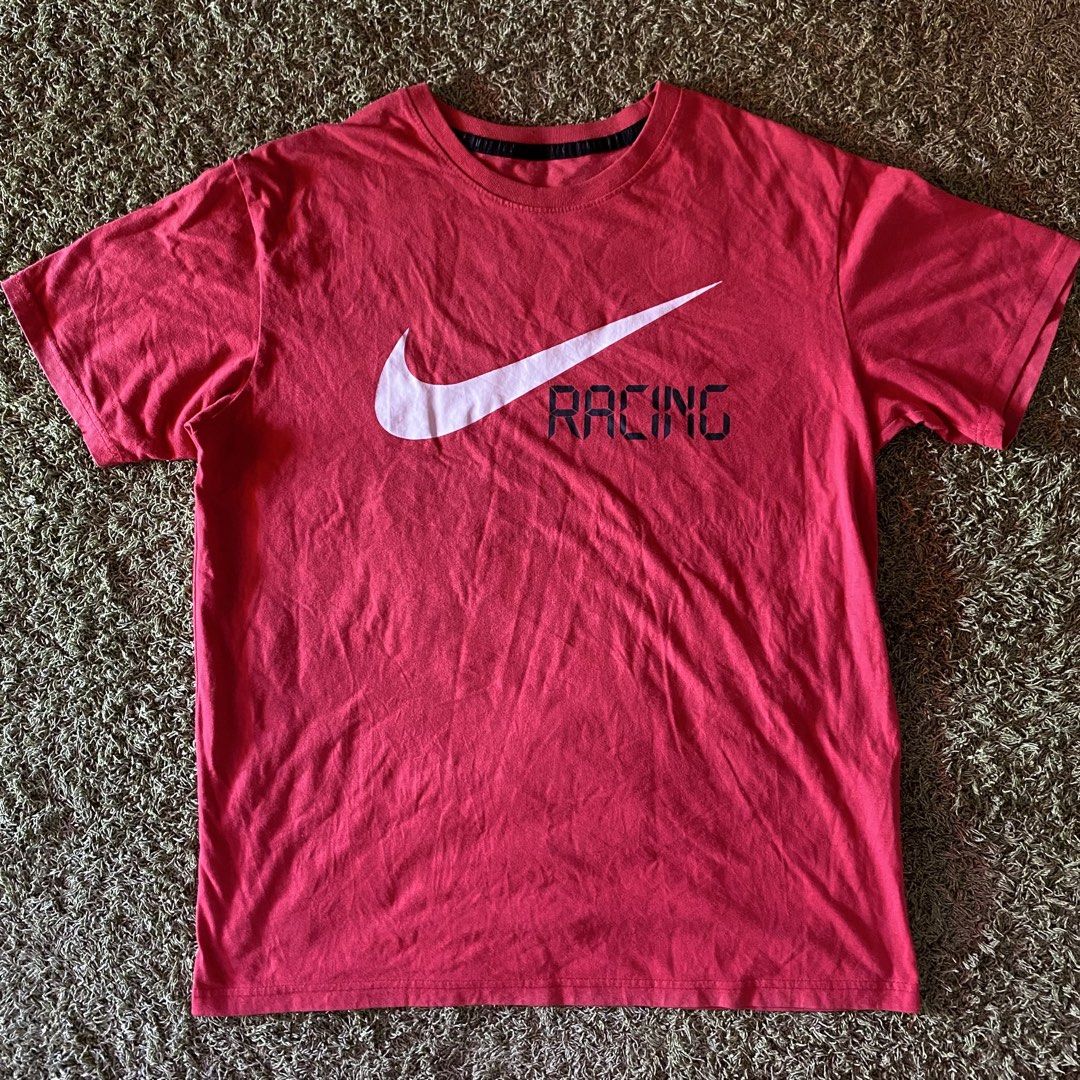 Nike Racing T-Shirt Red (Category: Tshirts & Polo Shirts ) located in Davao. Submitted by thriftthegruntz (Listing ID 1441122231, Image 1). Description: - Authentic red Nike t-shirt - Features iconic swoosh logo - 'RACING' text printed alongside logo - Made from comfortable cotton material - Ideal for casual wear or sports activities - Simple, classic, and versatile design.