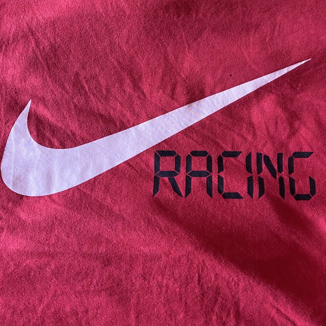Nike Racing T-Shirt Red (Category: Tshirts & Polo Shirts ) located in Davao. Submitted by thriftthegruntz (Listing ID 1441122231, Image 2). Description: - Authentic red Nike t-shirt - Features iconic swoosh logo - 'RACING' text printed alongside logo - Made from comfortable cotton material - Ideal for casual wear or sports activities - Simple, classic, and versatile design.
