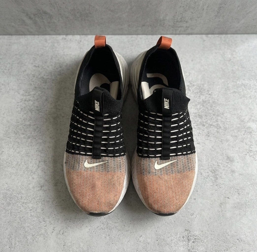 Nike React Phantom Run Flyknit 2 Men US11 Faded Toe Swoosh (Category: Sneakers) located in Paranaque City. Submitted by thepopneverstops (Listing ID 1438442522, Image 1). Description: Condition Rating 7/10 — used Nike React Phantom Run Flyknit 2 slip-on runners. Uppers show fading, especially on the colored knit area, and the small Swoosh logo near the toe is separating/peeling. Midsole and outsole have normal dirt from wear but no major structur