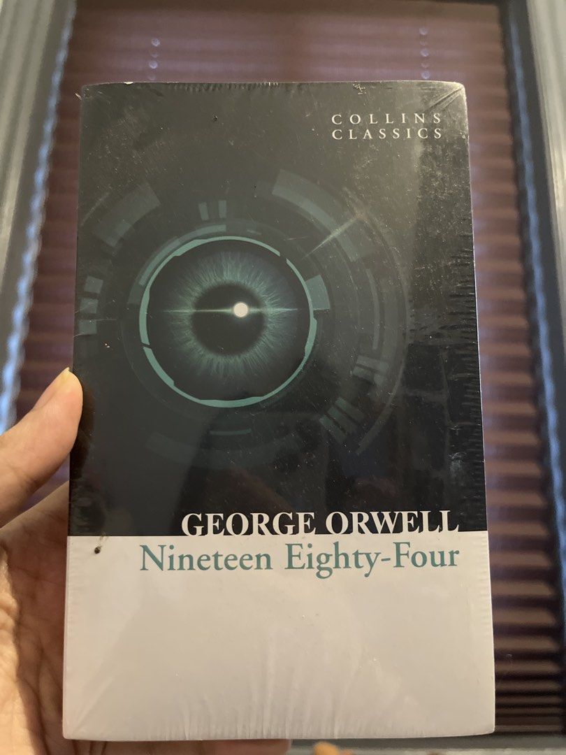 Nineteen Eighty-Four George Orwell (Category: Storybooks) located in Quezon City. Submitted by andreasy2 (Listing ID 1441047309, Image 1). Description: - "Nineteen Eighty-Four" by George Orwell - Collins Classics edition - Brand new and sealed - Classic dystopian novel - Explores themes of totalitarianism and surveillance - Features insight into the author and a glossary.
