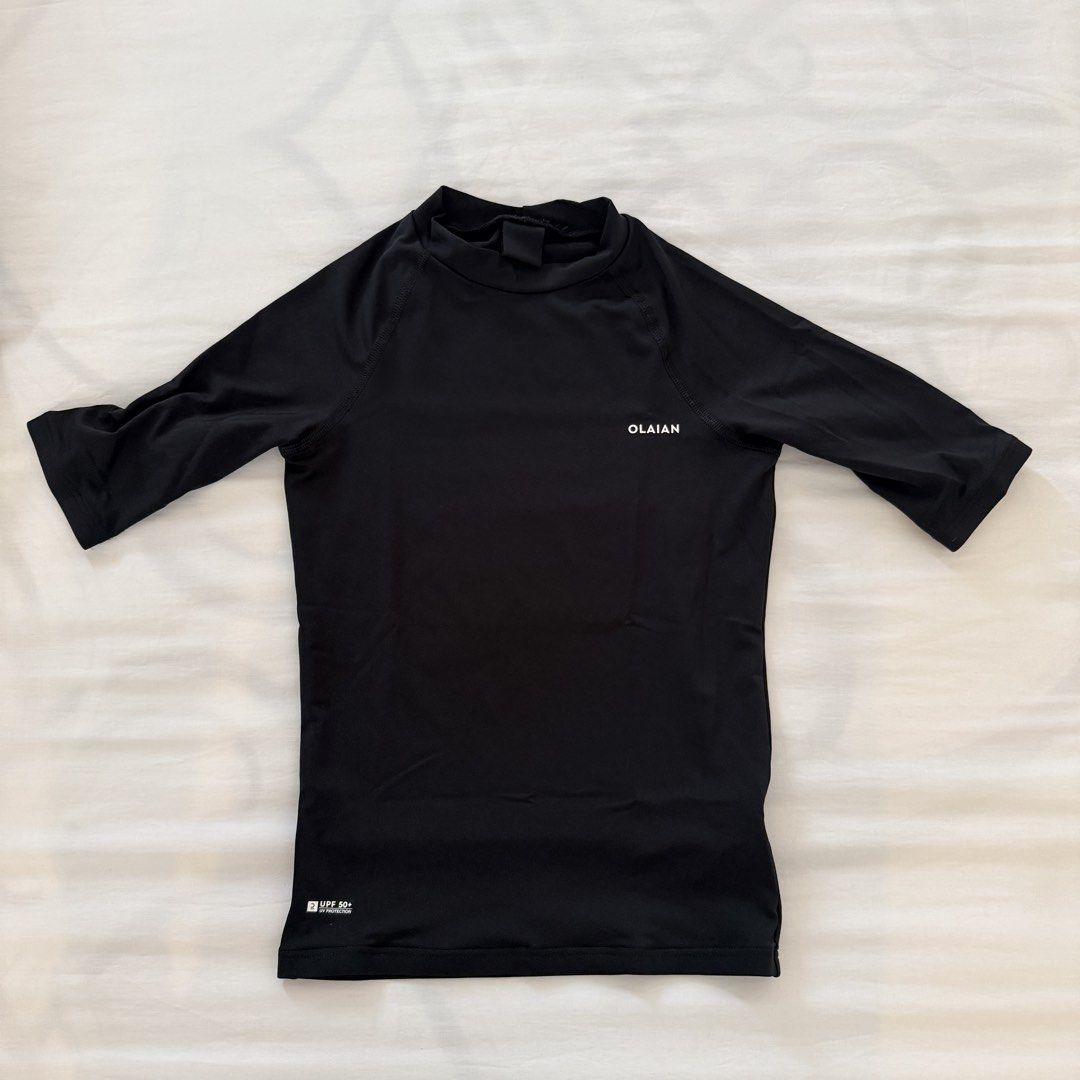 OLAIAN Black Rash Guard 6-7yo (Category: Babies & Kids Fashion) located in Paranaque City. Submitted by shopvillas (Listing ID 1441000729, Image 1). Description: - Black Olaian rash guard - 3/4 sleeves - Mock neck - UPF 50+ sun protection - Ideal for swimming and water activities - Smooth and stretchy fabric.