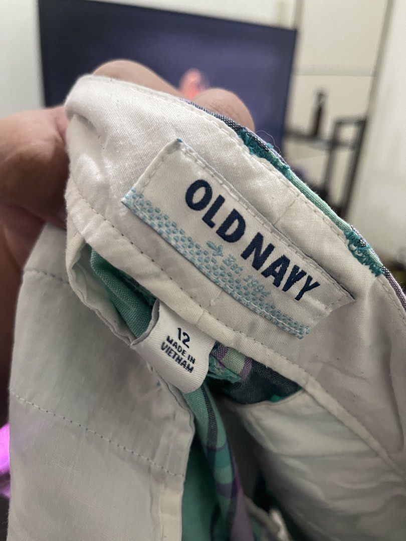 Old Navy Plaid Shorts Size 12 (Category: Shorts) located in Caloocan City. Submitted by yllainefaith (Listing ID 1441016690, Image 2). Description: - Cute plaid shorts from Old Navy - Classic blue, purple, and green plaid pattern - Button and zip front closure - Perfect for casual wear - Size 12.