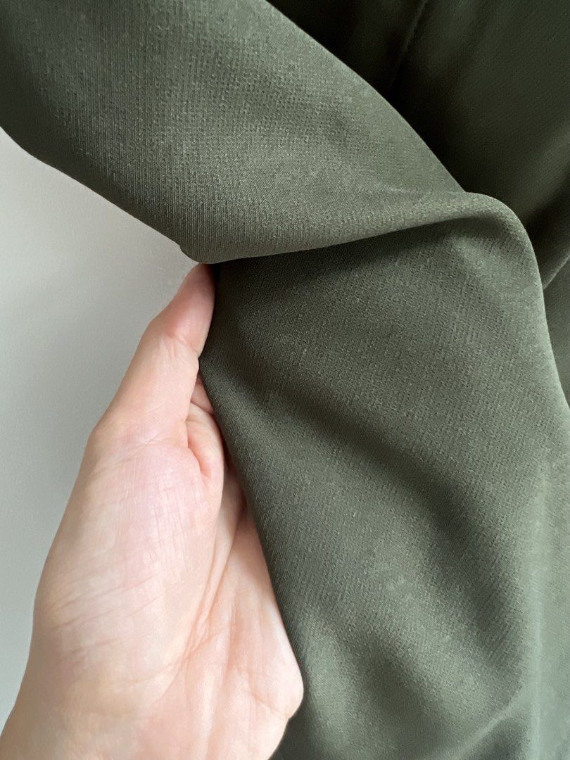 Olive Green Button Front Midi Skirt with Slit (Category: Skirts) located in Paranaque City. Submitted by papermuse (Listing ID 1441034247, Image 3). Description: - Chic tailored olive green midi skirt - Flattering A-line silhouette - Stylish button-front detail - Convenient belt loops - Functional pockets - Fabric with a lovely drape - Versatile for work or casual wear - Effortless to style MOP: BPI / GCash Shipping: Gogoxpress, Grab, Lalamove.