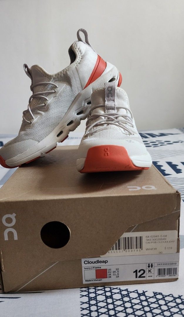 ON Cloudleap Running Shoes White Orange Size 12 (Category: Babies & Kids Fashion) located in Imus. Submitted by sashafame (Listing ID 1440963586, Image 1). Description: - ON Cloudleap running shoes - Color: White with orange accents - Size: 12 - Includes original box - Ideal for running and everyday wear - Lightweight and comfortable design almost new.