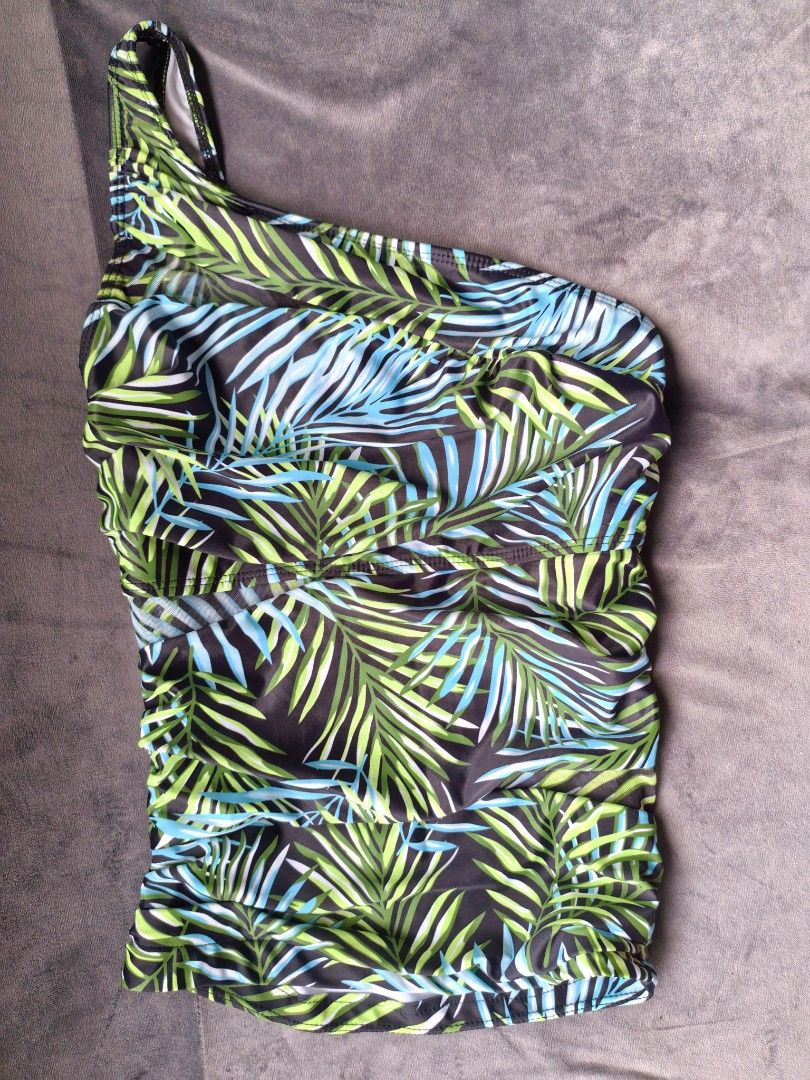 One-shoulder Tropical Print Swimsuit (Category: Bikinis & Swimsuits) located in Taguig. Submitted by iggysclutter (Listing ID 1441002819, Image 2). Description: - One-shoulder design - Tropical palm leaf print (black, green, blue) - Flattering side ruching - Comfortable and stylish - Ideal for beach vacations and pool days.