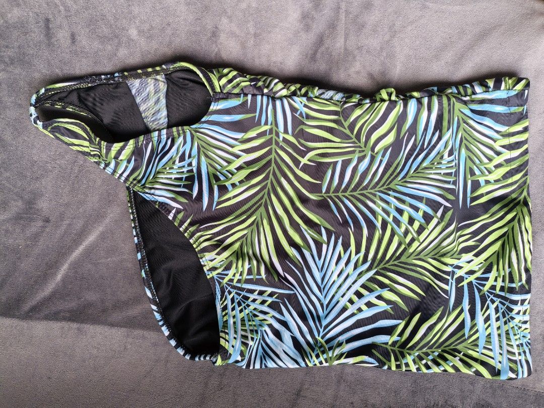 One-shoulder Tropical Print Swimsuit (Category: Bikinis & Swimsuits) located in Taguig. Submitted by iggysclutter (Listing ID 1441002819, Image 3). Description: - One-shoulder design - Tropical palm leaf print (black, green, blue) - Flattering side ruching - Comfortable and stylish - Ideal for beach vacations and pool days.