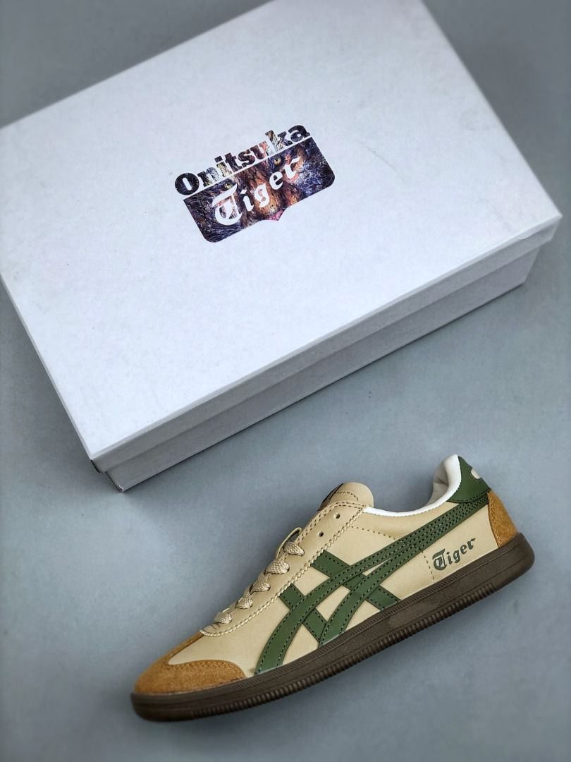 Onitsuka Tiger Tokuten Beige Dark Green Leather Suede Sneakers EU35-EU45 (Category: Sneakers) located in Singapore. Submitted by umistore (Listing ID 1441150369, Image 3). Description: - Classic Onitsuka Tiger sneakers - Beige leather with green stripes - Suede toe cap - Lace-up closure - Comfortable for everyday wear - Comes with original box - Great addition to any collection.
