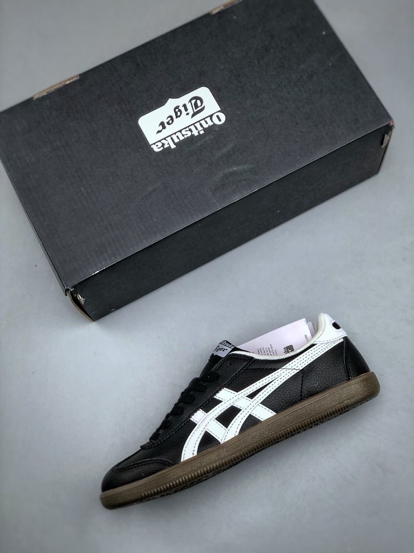 Onitsuka Tiger Tokuten Black White Gum Leather Sneakers EU35-EU45 (Category: Sneakers) located in Singapore. Submitted by umistore (Listing ID 1441155934, Image 3). Description: - Classic Onitsuka Tiger Mexico 66 - Colour: Black with White Stripes - Features a Gum Sole - Comes with Original Box - Ideal for Casual Wear or Sports.