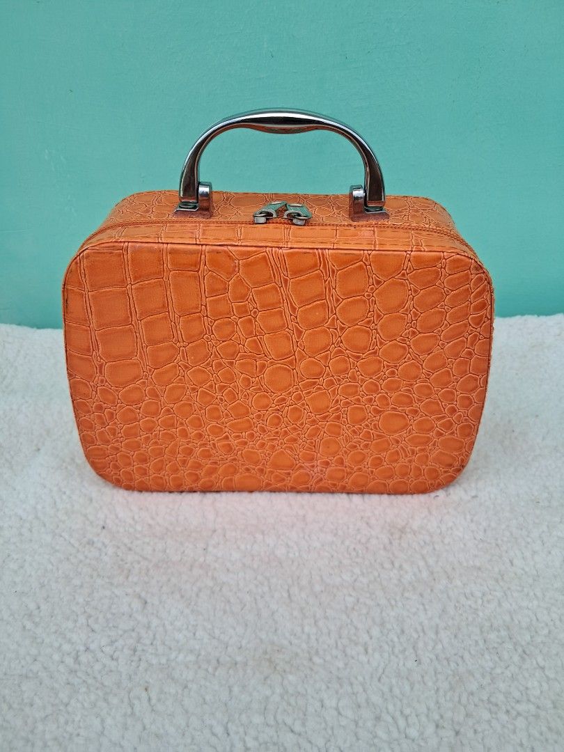 Orange Crocodile Print Makeup Case with Mirror from JAPAN (Category: Makeup) located in Batangas. Submitted by buddy_and_willow (Listing ID 1441006239, Image 1). Description: ‼️PLEASE READ FULL DESCRIPTION and SEE ALL PHOTOS‼️ - Preloved from Japan - Adorable orange makeup case - Unique crocodile texture, patent faux leather material - Fun leopard print interior lining - Built-in mirror inside (mirror is removable for cleaning) - Sturdy silver to