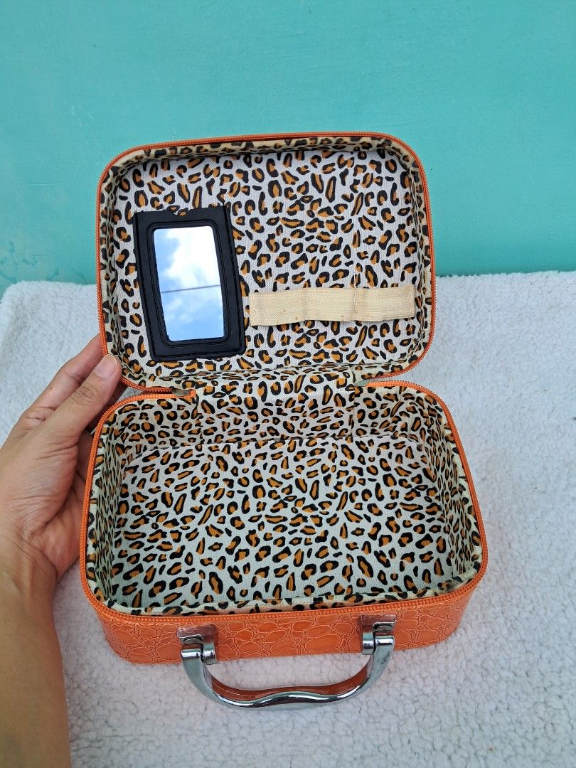 Orange Crocodile Print Makeup Case with Mirror from JAPAN (Category: Makeup) located in Batangas. Submitted by buddy_and_willow (Listing ID 1441006239, Image 3). Description: ‼️PLEASE READ FULL DESCRIPTION and SEE ALL PHOTOS‼️ - Preloved from Japan - Adorable orange makeup case - Unique crocodile texture, patent faux leather material - Fun leopard print interior lining - Built-in mirror inside (mirror is removable for cleaning) - Sturdy silver to