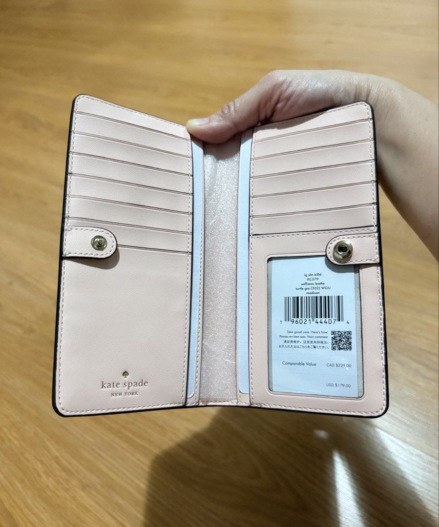 Original Kate Spade Madison Large Slim Bifold Wallet (Category: Luxury Bags & Wallets) located in Paranaque City. Submitted by justheog (Listing ID 1440952507, Image 3). Description: 💚 Color: Turtle Green 💚 Light-Gold-Toned Hardware 💚 Saffiano Leather 💚 L:6.73” W:0.94” H:3.54” 💚 Bought from Kate Spade US.