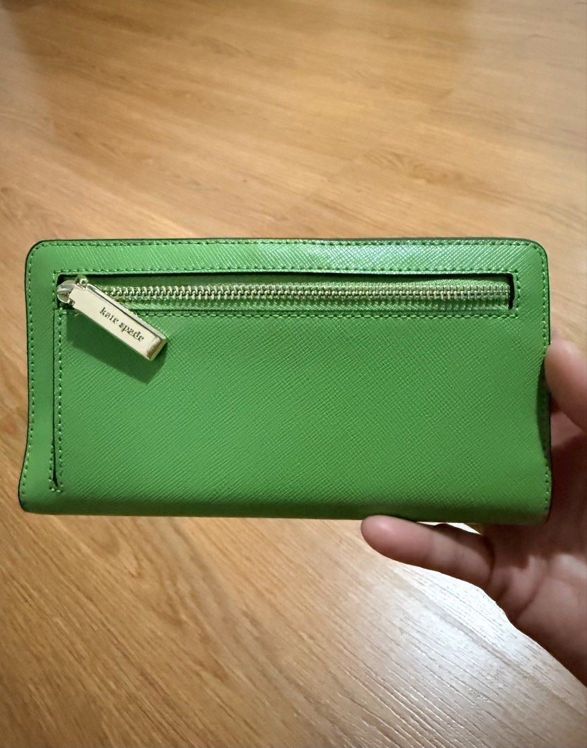 Original Kate Spade Madison Large Slim Bifold Wallet (Category: Luxury Bags & Wallets) located in Paranaque City. Submitted by justheog (Listing ID 1440952507, Image 2). Description: 💚 Color: Turtle Green 💚 Light-Gold-Toned Hardware 💚 Saffiano Leather 💚 L:6.73” W:0.94” H:3.54” 💚 Bought from Kate Spade US.