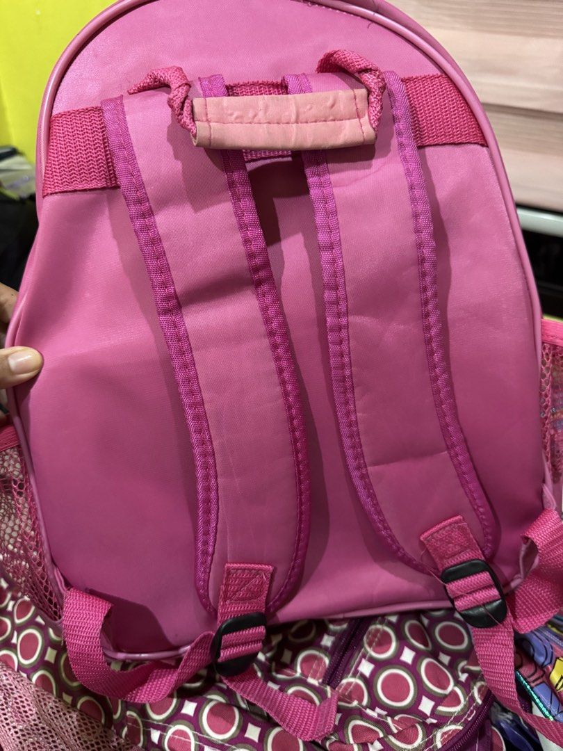 Peanuts Snoopy & Woodstock Backpack (Category: Backpacks) located in Manila. Submitted by kreeespy (Listing ID 1441068887, Image 2). Description: - Adorable pink hardcase backpack featuring a vibrant Snoopy and Woodstock graphic. - Includes a spacious main compartment for essentials. - Convenient front pocket compartment with zipper pull for quick access. - Adjustable straps ensure a comfortable fit for all. - Versatile for school, travel, or eve
