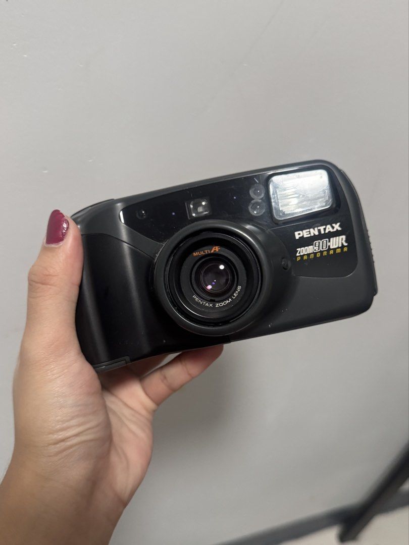 Pentax Zoom 90-WR Program 35mm Film Camera (Category: Cameras) located in Bocaue. Submitted by nyotcha (Listing ID 1441034662, Image 1). Description: - Pentax Zoom 90-WR Program 35mm point-and-shoot camera - Comes with 2 film canisters ISSUE: - need to replace battery - shows H3 issue .