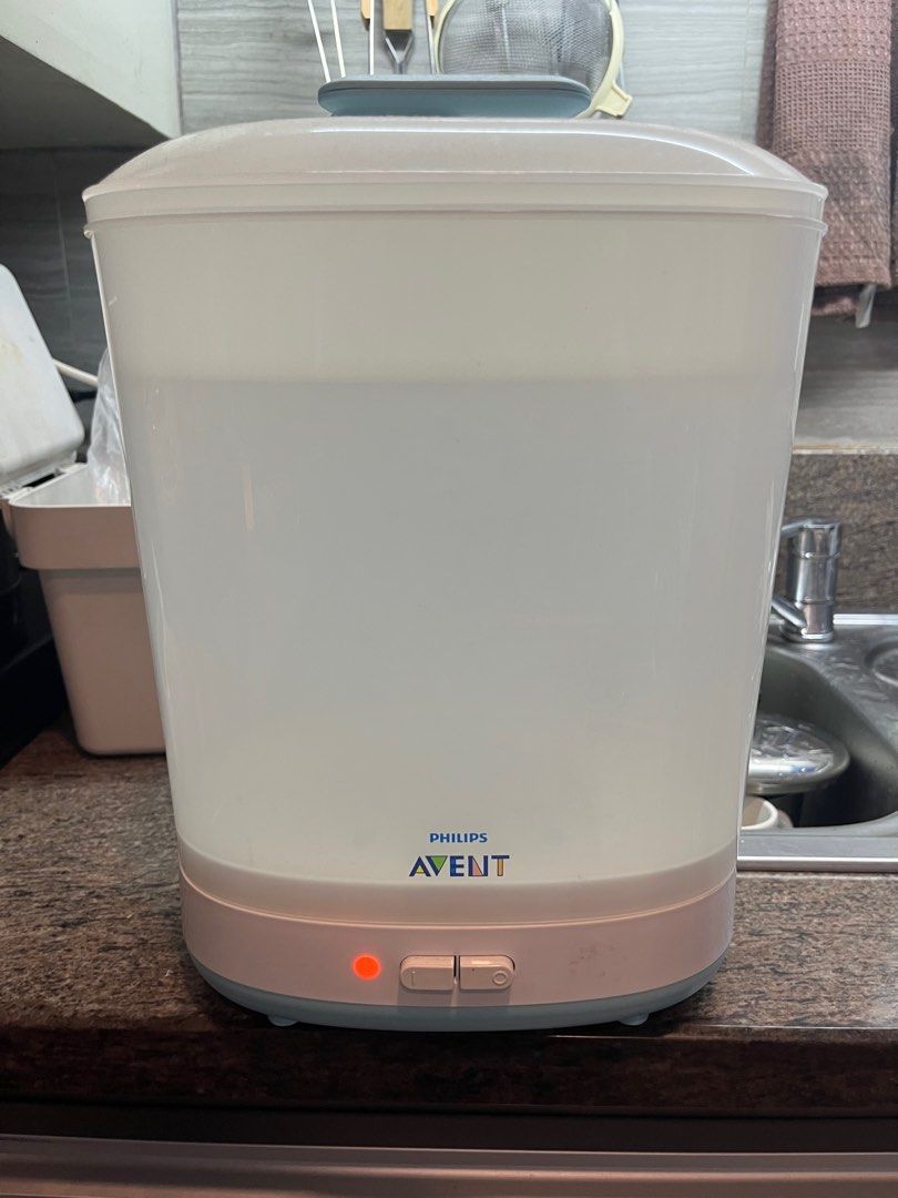 Philips Avent Sterilizer & Baby Feeding Accessories Bundle (Category: Breastfeeding & Bottle Feeding) located in Taguig. Submitted by liomarket (Listing ID 1440979296, Image 2). Description: - Bundle of essential baby feeding items - Includes Philips Avent electric steam sterilizer (good working condition) - Assorted feeding items: plates, spoons, forks, cups, pacifiers - Some items still in original packaging - Ideal for new parents looking for 