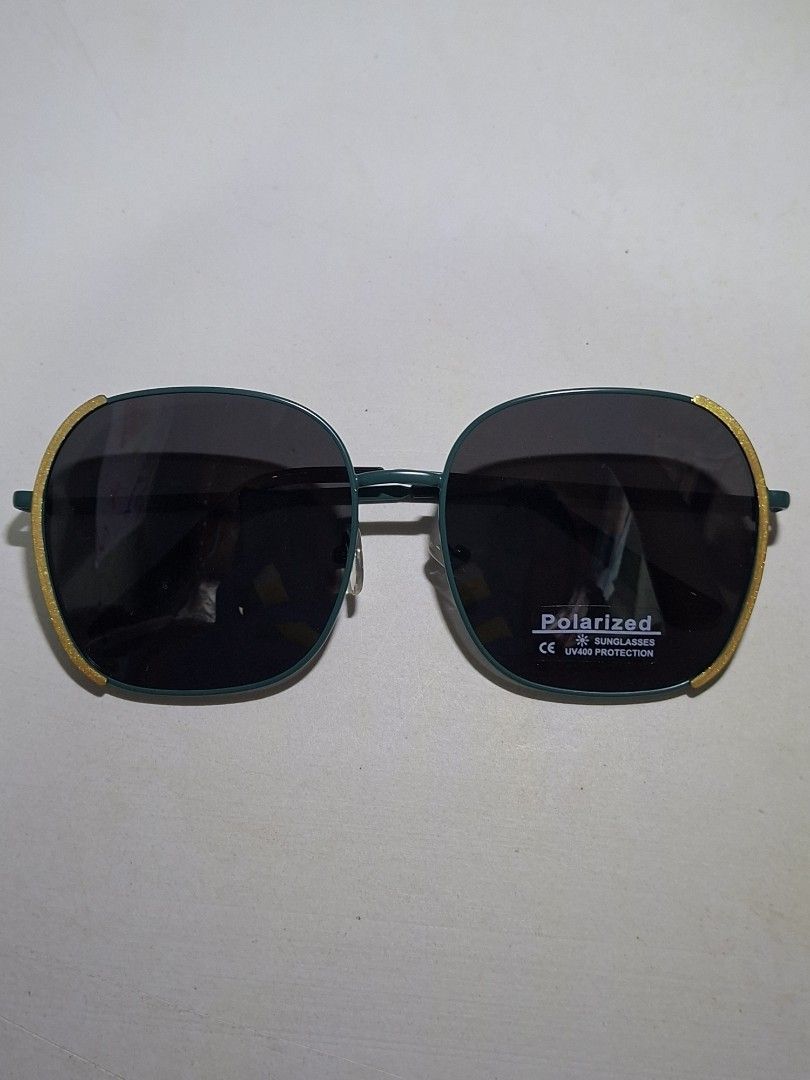 Polarized Sunglasses Teal Frame Yellow Trim (Category: Sunglasses & Eyewear) located in Muntinlupa City. Submitted by jsassorteditems (Listing ID 1441079064, Image 1). Description: - Teal frame sunglasses with stylish yellow trim. - Polarized lenses effectively block sun glare. - Ideal for all your outdoor activities. - Features a simple and classic design..