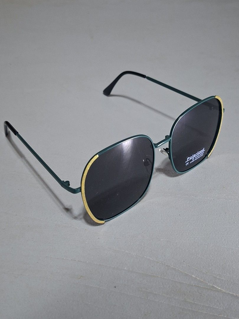 Polarized Sunglasses Teal Frame Yellow Trim (Category: Sunglasses & Eyewear) located in Muntinlupa City. Submitted by jsassorteditems (Listing ID 1441079064, Image 2). Description: - Teal frame sunglasses with stylish yellow trim. - Polarized lenses effectively block sun glare. - Ideal for all your outdoor activities. - Features a simple and classic design..
