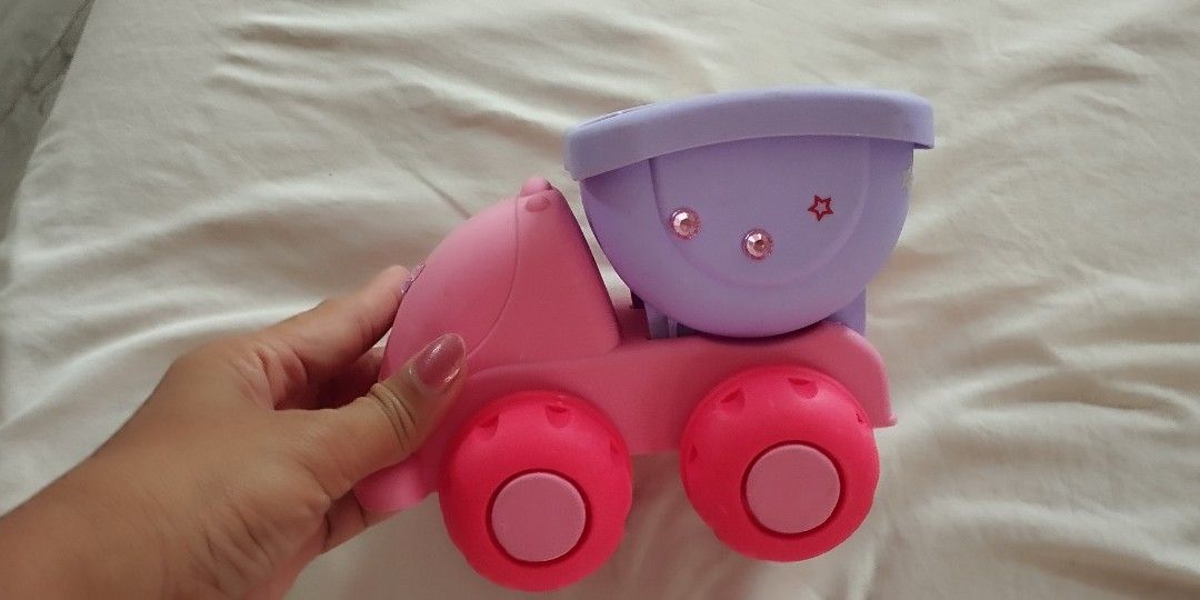Potion truck and soft dump truck (Category: Kids Toys) located in Makati City. Submitted by larasdowry (Listing ID 1440190338, Image 3). Description: Fun pink and purple toy food truck with gold accents. Opens up to reveal interior with seating and serving areas. Great for imaginative play! it's 2000 in shoppee. no more other accessories. take both for 300.