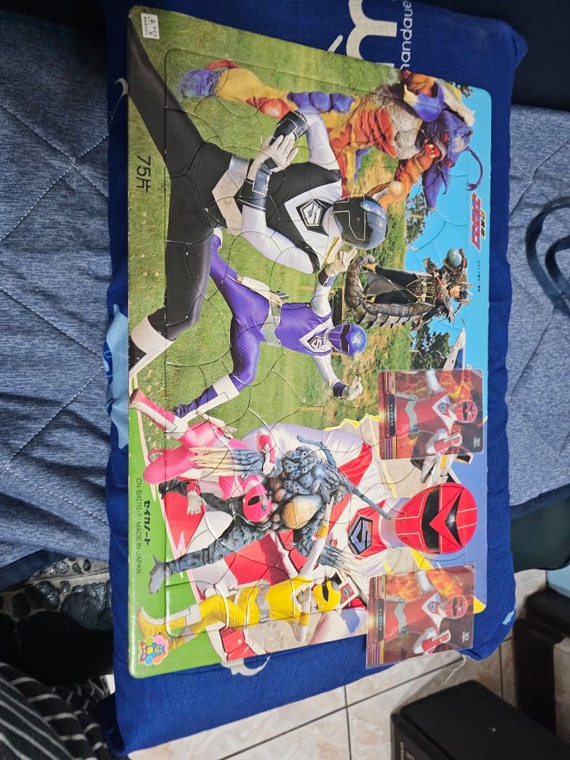 Power Rangers Puzzle with Character Cards (Category: Board Games & Puzzles) located in Muntinlupa City. Submitted by jojiepogi123 (Listing ID 1441129134, Image 3). Description: Power Rangers puzzle featuring multiple rangers and monsters. Includes character cards. Great for any Power Rangers fan. Fun activity for kids or collectors. Made in Japan. 2 cards red mask.