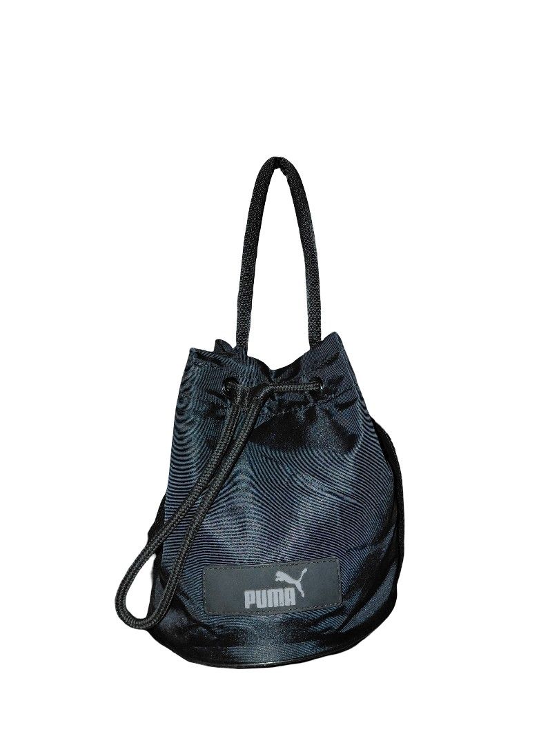 PUMA Core Pop Bucket Cross-Body Bag (Category: Cross-body Bags) located in Cabanatuan. Submitted by ggorae (Listing ID 1441065104, Image 1). Description: This is personally owned, so please manage your expectations. Color may vary due to lighting and flash. – 100% Original, bought from PUMA official orange store. – Condition: 8.5/10. The silicon logo started to break. Please check the photos to see the actual condition. – 17 cm x 17 cm x 20 cm, 2