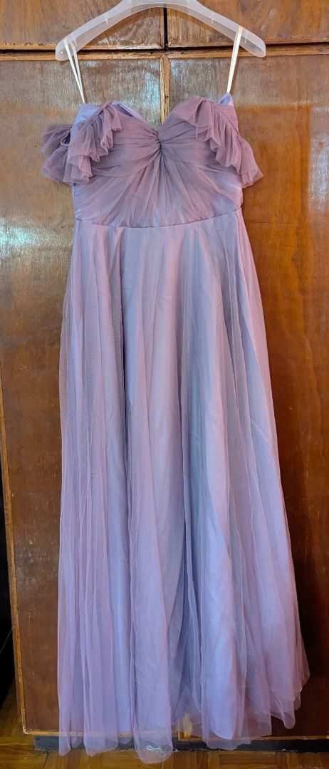 Purple Tulle Off-Shoulder Ruffle Gown (Category: Evening dresses & gowns) located in Caloocan City. Submitted by zayzay_18 (Listing ID 1440984707, Image 1). Description: - Beautiful purple gown with elegant tulle overlay. - Sweetheart neckline with romantic ruffled off-shoulder sleeves. - Flattering ruched detail on the bodice. - Full and flowing skirt for a dramatic silhouette. - Ideal for formal events, balls, or any special occasion. - Adjusta