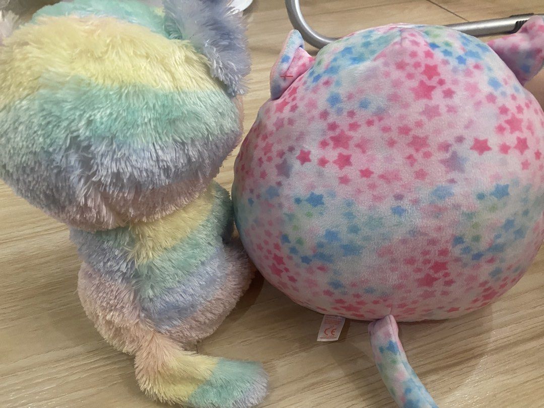 Rainbow Cat & Pink Star Squishmallow (Category: Plushies & Soft Toys) located in Makati City. Submitted by ann.declutter (Listing ID 1441023673, Image 2). Description: - Adorable rainbow cat plushie with big sparkly eyes. - Authentic Ty brand tag included. - Round, soft pink plushie adorned with blue and purple stars. - Both plushies are incredibly soft and cuddly. - Ideal gifts for children or must-have additions for collectors..