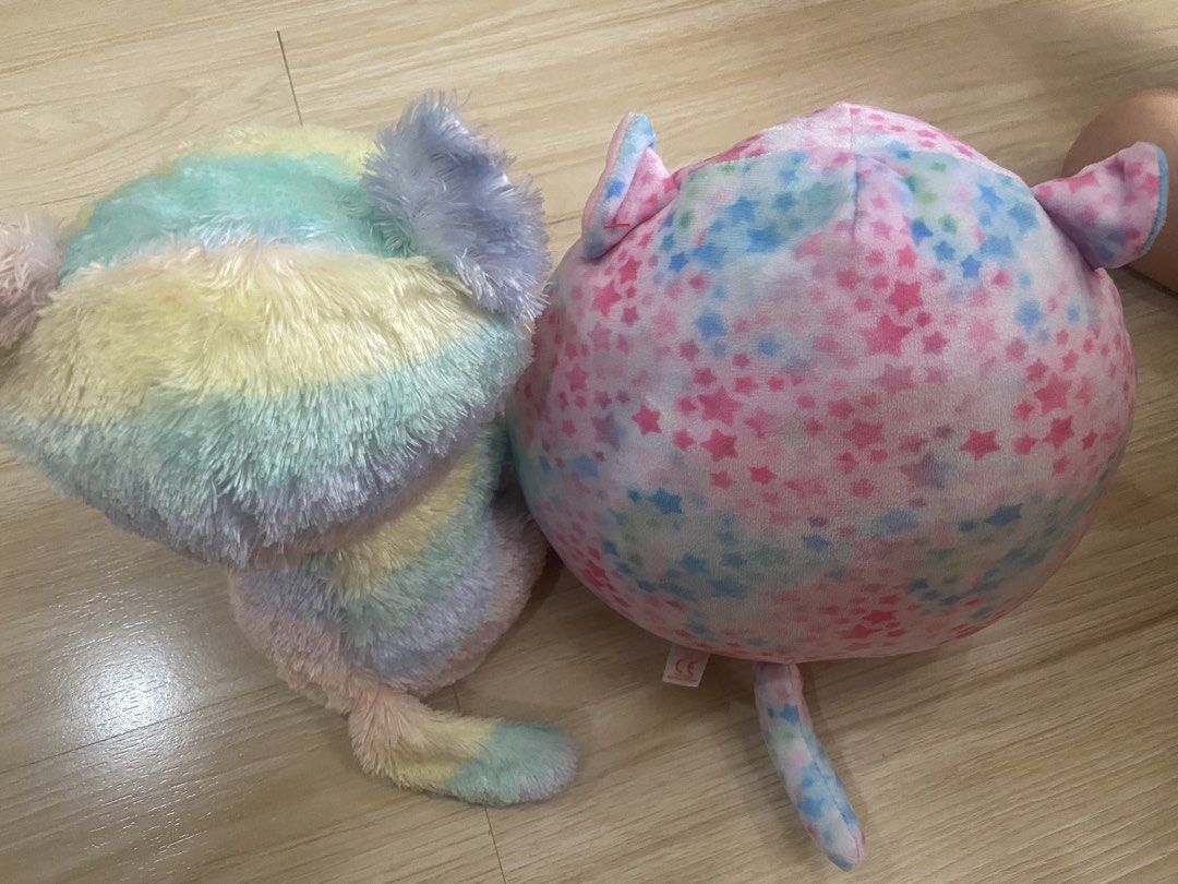 Rainbow Cat & Pink Star Squishmallow (Category: Plushies & Soft Toys) located in Makati City. Submitted by ann.declutter (Listing ID 1441023673, Image 3). Description: - Adorable rainbow cat plushie with big sparkly eyes. - Authentic Ty brand tag included. - Round, soft pink plushie adorned with blue and purple stars. - Both plushies are incredibly soft and cuddly. - Ideal gifts for children or must-have additions for collectors..
