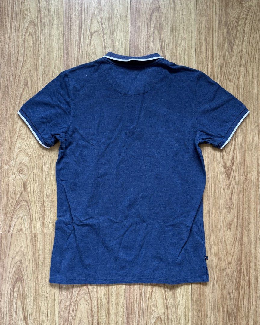 Regatta Essentials Polo Shirt (Category: Tshirts & Polo Shirts ) located in Taytay. Submitted by nextsentials (Listing ID 1441054011, Image 2). Description: - Authentic Regatta Essentials polo shirt - Blue with white stripe on collar and sleeves - Comfortable, regular fit - Good for casual, everyday use Measurements: Body length - 62cm Chest width - 45cm Shoulder width - 40cm Sleeve length - 18cm.