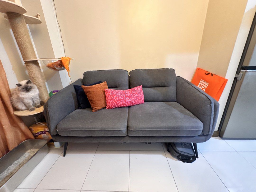 ROBIN Sofa (Mandaue Foam) (Category: Sofas) located in Quezon City. Submitted by tin.008 (Listing ID 1441101667, Image 2). Description: - ROBIN 2-Seater Sofa - Brand: Mandaue Foam - Material: Fabric - Color: Dark Gray - Style: Modern, sleek design with tapered legs - bought last January - never been wet - Dimensions: 179.1cm (L) x 88.9cm (W) x 86.3cm (H) - Perfect for apartments, condos, or small living spaces - bought at 28,000 - fits 3 people -