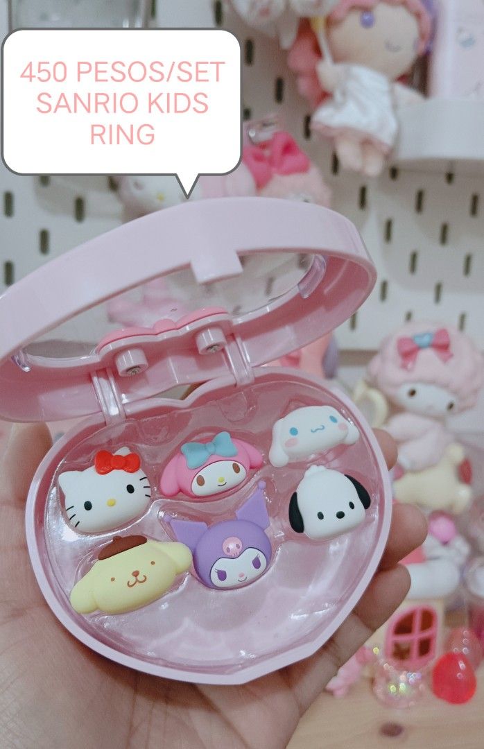 Sanrio Kids Ring Set in Heart Case (Category: Rings) located in Manila. Submitted by masterlei (Listing ID 1441112121, Image 1). Description: - Adorable set of Sanrio character rings - Features Kitty, My Melody, Cinnamoroll, Pompompurin, and Kuromi - Comes in a charming pink heart-shaped case - Perfect for young Sanrio fans - Makes a wonderful gift or party favor.