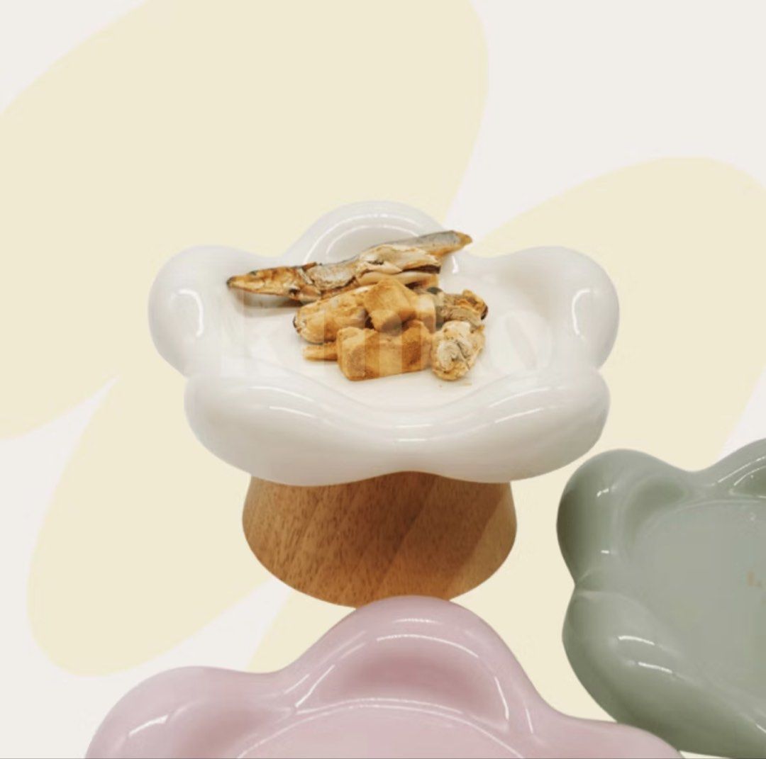 Shallow Pet Ceramic Bowl/Trinket Dish (Category: Dinnerware & Cutlery) located in Taguig. Submitted by mimosaaa_ (Listing ID 1441045596, Image 1). Description: Shallow ceramic cat food bowl. Got this from KinKo on orange app for my cats, tried once and they didn’t like it 🥲 Pristine condition! - Pastel Pink, Mint Green, White - Can be used as a trinket dish! - Selling for PHP 800 each, got them for PHP 840. Comes with their wooden stands and unu