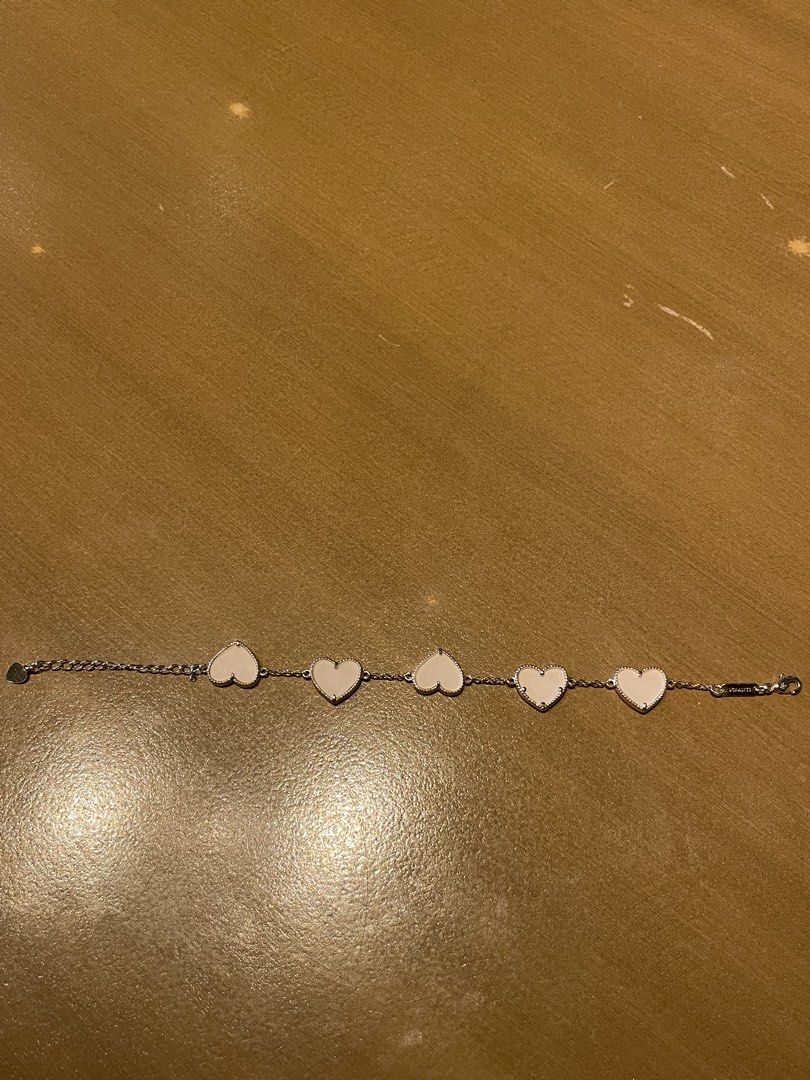 Silver Bracelet with Pink Heart Charms (Category: Bracelets) located in Pasig City. Submitted by jewelsbymac (Listing ID 1441009378, Image 2). Description: Details: ✔ Material: Premium Stainless Steel with gold tone finish — tarnish-free, rust-proof & color lasting ✔ ✔ Design: Five lovely heart motifs with smooth soft pink inlay, polished gold border — simple, sweet and elegant ✔ Size: Adjustable chain with extender — fits all wrist sizes comfort