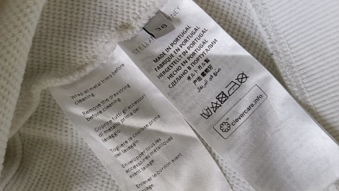 Stella McCartney 2001 Hoodie White (Category: Coats, Jackets and Outerwear) located in Cebu City. Submitted by mcmapio (Listing ID 1441049821, Image 3). Description: - White Stella McCartney hoodie - Cropped style - Drawstring hood - Features 'STELLA MCCARTNEY 2001.' text on the front - Made in Portugal - Size 38.