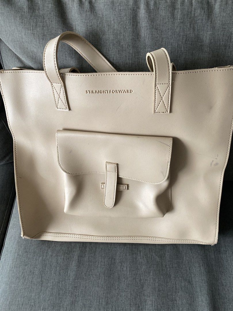 Straight Forward Beige Tote Bag with Front Pocket (Category: Sling Bags) located in Quezon City. Submitted by viber9163490242 (Listing ID 1441039499, Image 1). Description: - Beige tote bag from Straight Forward - Front pocket with buckle closure - Two top handles - Simple and classic design - Ideal for everyday use - Minor marks on exterior (please check photos for details).