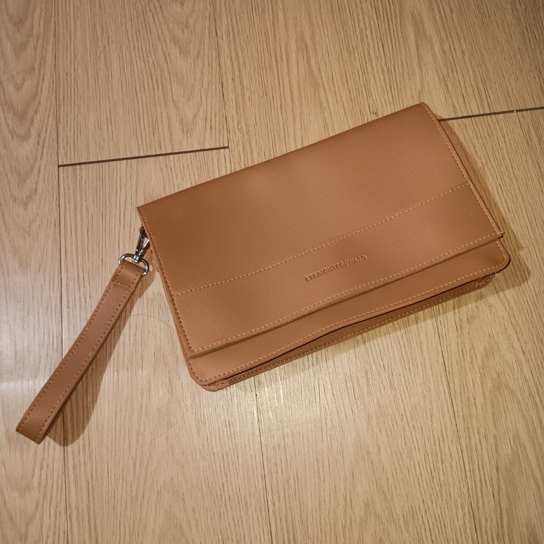STRAIGHTFORWARD Vegan Leather Clutch Bag (Category: Clutches) located in Taguig. Submitted by ncomn (Listing ID 1441088968, Image 1). Description: - Vegan leather clutch with removal wrist strap - Secure magnetic closure inside - No scratches, slight deformed, never used, like new.