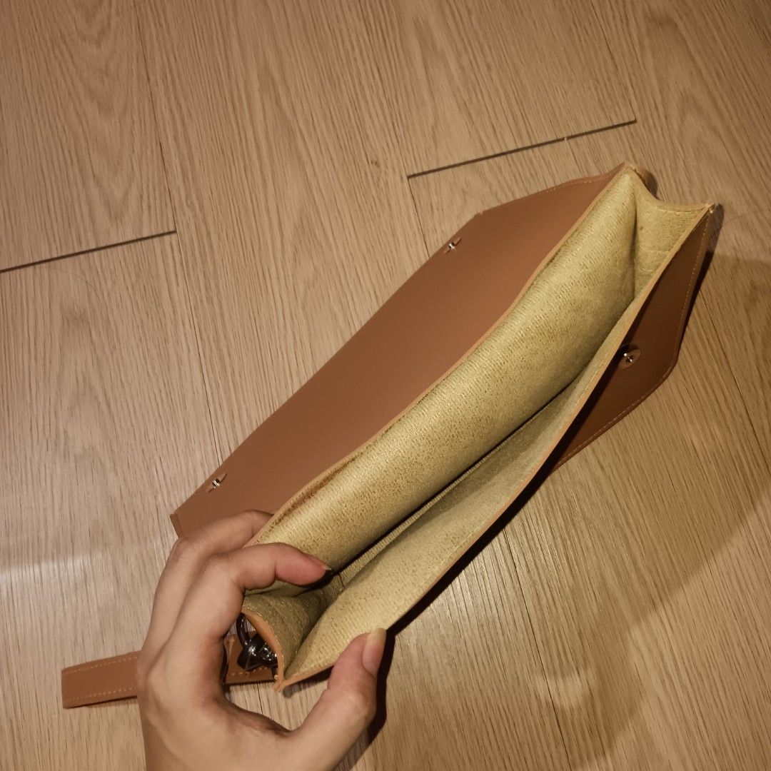 STRAIGHTFORWARD Vegan Leather Clutch Bag (Category: Clutches) located in Taguig. Submitted by ncomn (Listing ID 1441088968, Image 3). Description: - Vegan leather clutch with removal wrist strap - Secure magnetic closure inside - No scratches, slight deformed, never used, like new.