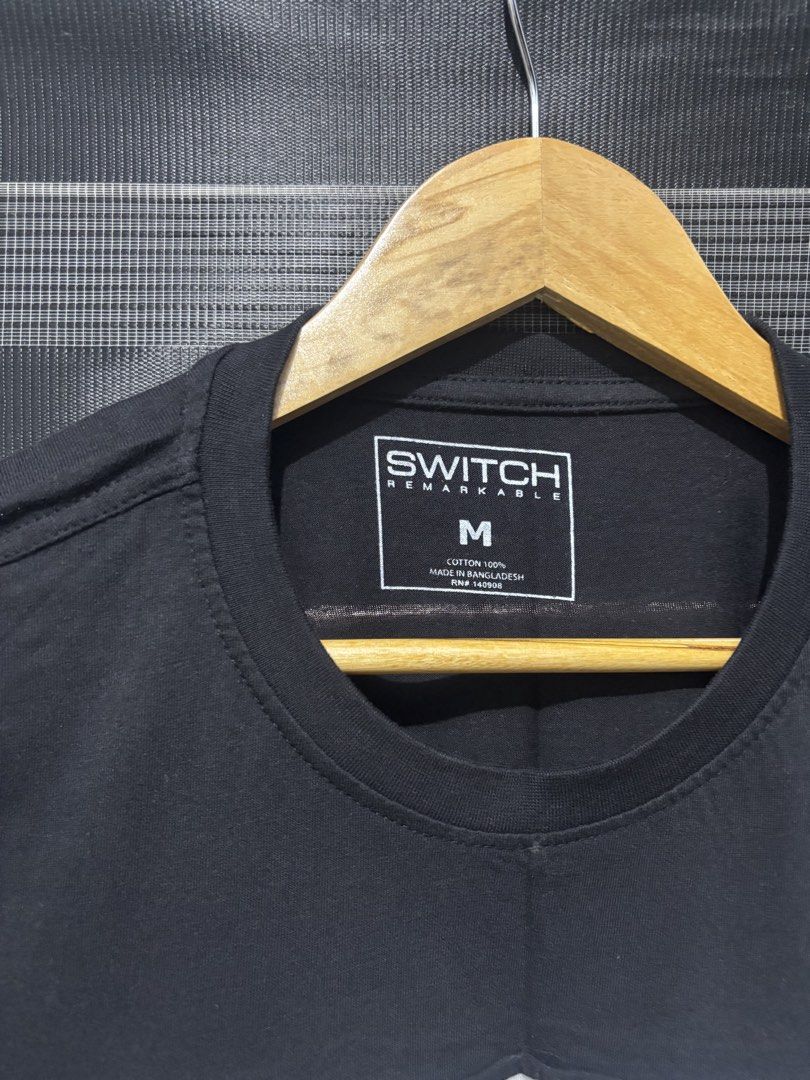 SWITCH REMARKABLE Black Cut-out T-shirt Size M (Category: Tshirts & Polo Shirts ) located in Manila. Submitted by jonard2297 (Listing ID 1441053461, Image 3). Description: - Brand: SWITCH REMARKABLE - Color: Black - Size: Medium (M) - Design: Unique cut-out details with white lining - Features: Front zipper, cut-out sleeves - Material: 100% Cotton.