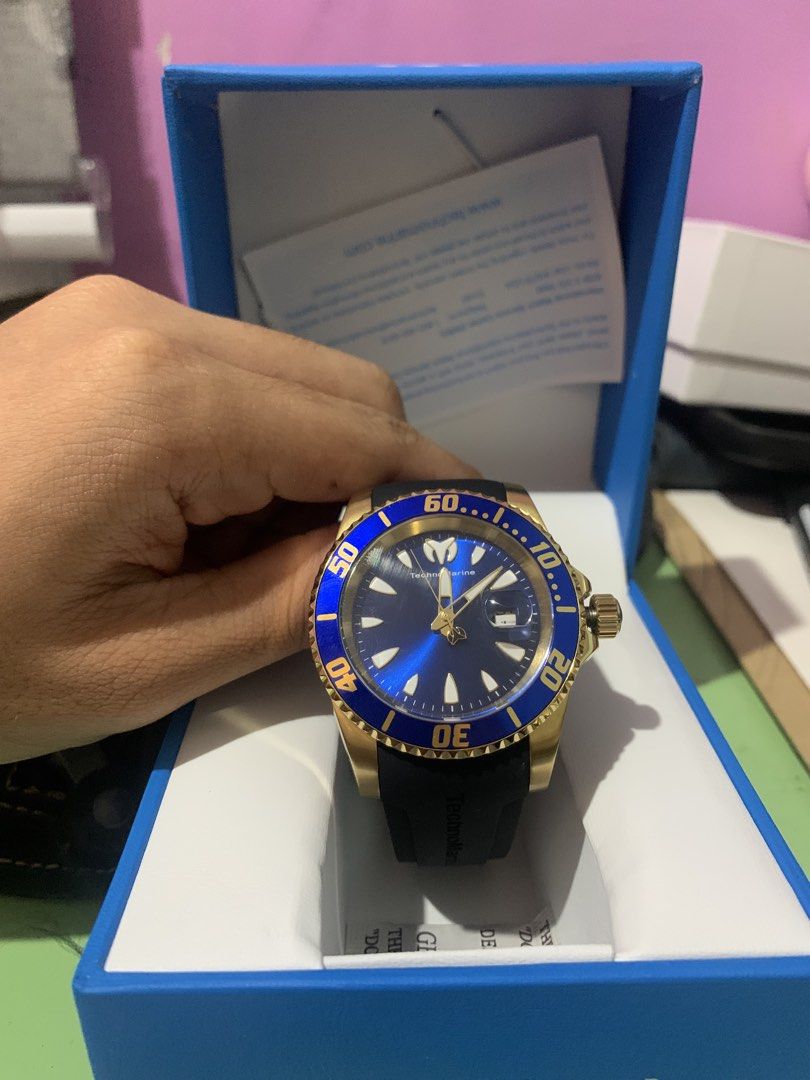 TechnoMarine TM-22015 Sea Manta (Category: Men's Watches) located in Manila. Submitted by oddriver.35237b (Listing ID 1441124947, Image 1). Description: - TechnoMarine Watch - Blue Dial with Gold Accents - Rotating Bezel - Black Rubber Strap - Original Box and Paperwork Included - Ideal for Diving and Everyday Wear - Ready for a New Owner.