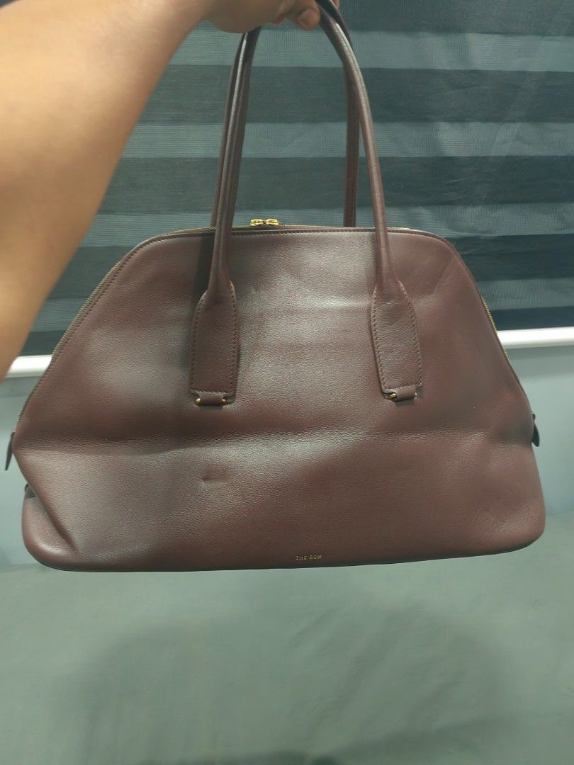 The row devon burgundy authentic (Category: Luxury Bags & Wallets) located in Santa Rosa. Submitted by _ba_mo_si_ (Listing ID 1441109091, Image 2). Description: The row burgundy devon bag worn by ariana grande Bag only Plus sf Dm.