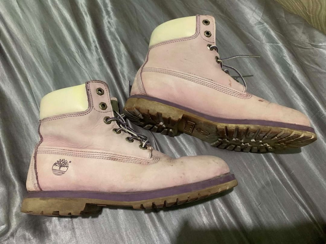 Timberland Pink Lace Up Boots (Category: Boots) located in Subic. Submitted by choksthrift (Listing ID 1441153864, Image 2). Description: - Classic pink Timberland lace-up boots. - Shows normal signs of wear: scuffs and dirt on soles and leather. - Unique and eye-catching color for Timberlands..