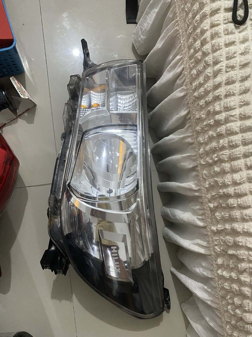 TOYOTA HILUX HEADLIGHT ASSEMBLY 2016-2026 BULB TYPE (Category: Body Parts and Accessories) located in Makati City. Submitted by escalajiff36696 (Listing ID 1441068334, Image 2). Description: - Brand new Toyota Hilux Headlight Assembly - Compatible with models 2016-2026 - Bulb type specified - Clear lens for optimal visibility - Enhances the look of your Hilux - Ready for installation.
